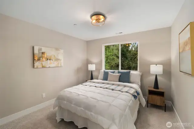 Spacious primary bedroom upstairs.