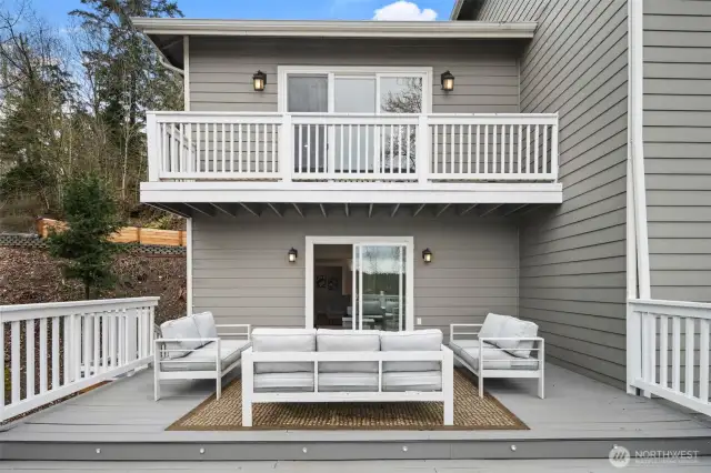 Deck on main floor and downstairs. Stairs with access to the yard below.