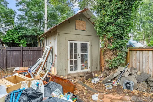 Spacious backyard shed.  (Yes, many of the original doors/finishes are stored on site.