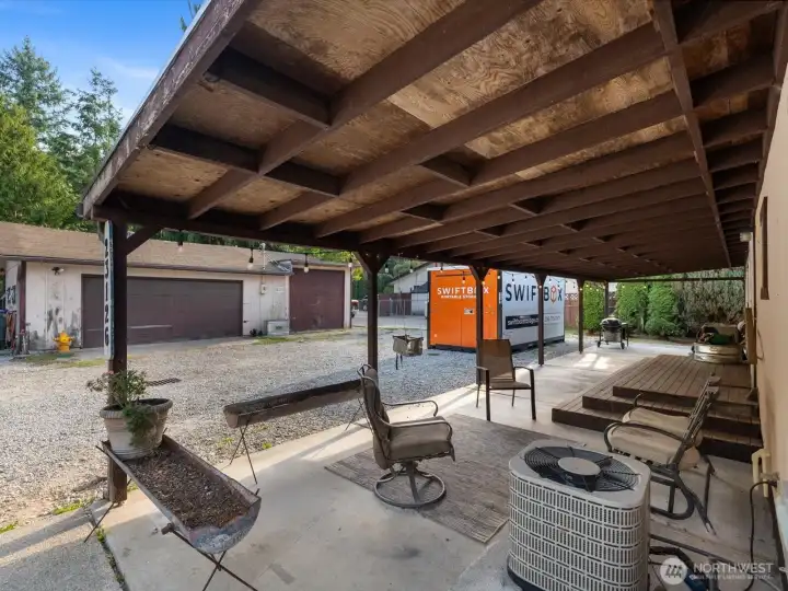 Covered front patio offers outdoor living year round.