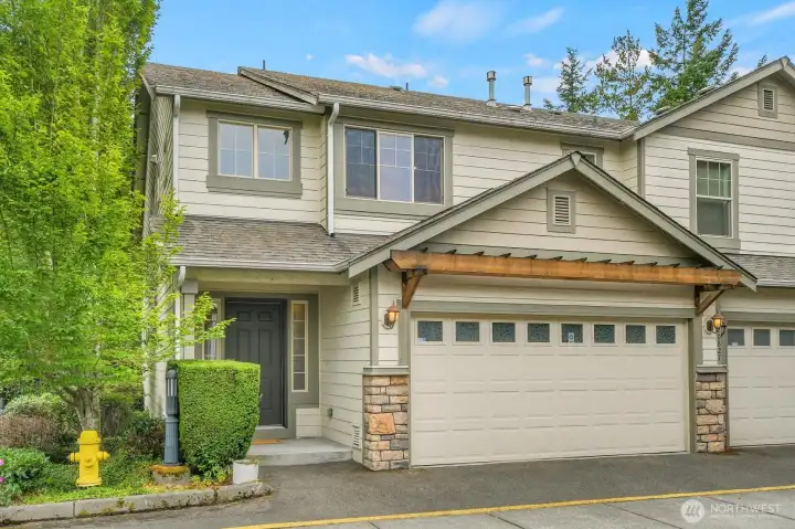 Front of Condo w/ Attached 2 Car Garage