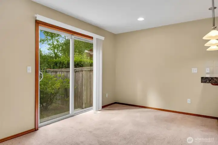 Dining Room w/ Slider to Fenced Backyard and Patio