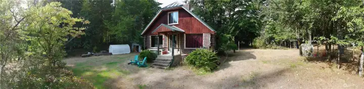 Front of house faces the 3.17 acres. Drive way is at the rear.