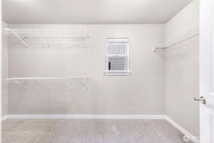 Spacious Walk in Closet in Primary Bathroom with brand new carpet