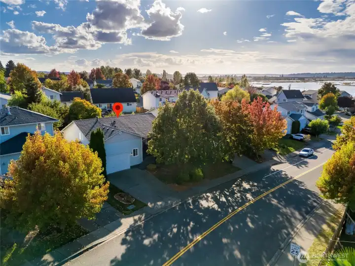 Set in the desirable Sunnyside/Harbor View Village neighborhood, this single-level rambler offers not just a home, but a lifestyle defined by comfort, connection, and natural beauty.