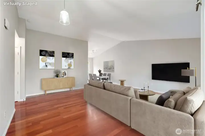 Step through the front door and be greeted by gleaming cherry hardwood floors that flow underfoot, soaring vaulted ceilings that fill the home with a sense of openness. [this photo is virtually staged]