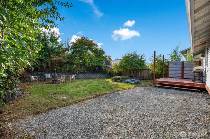 The backyard is fully fenced and beautifully landscaped, designed as both a retreat and a gathering place.
