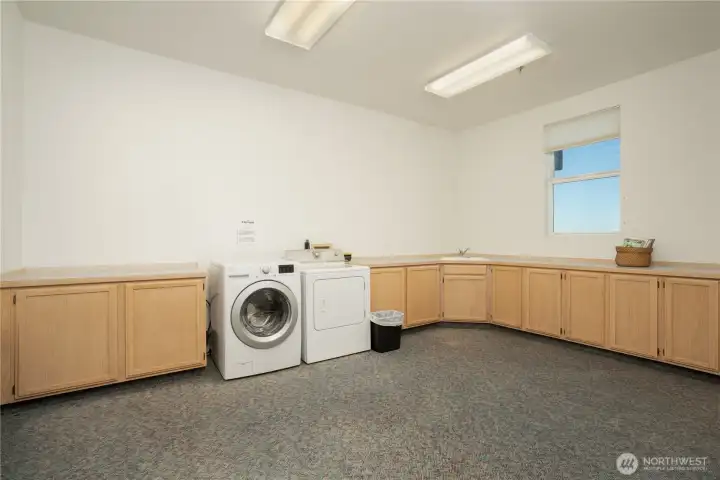 Common area shared laundry on garage floor