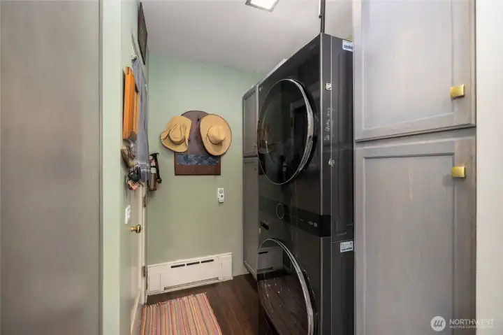 The laundry room has more storage and hookups for a stackable washer/dryer.