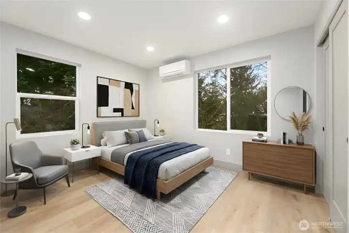 Upper level 2nd bedroom with mini-split heating/cooling system & 8 ft ceilings.