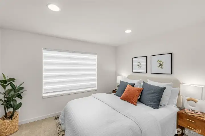 Flexible bedroom ready to adapt as a nursery office or workout zone reflects today’s versatile living needs.