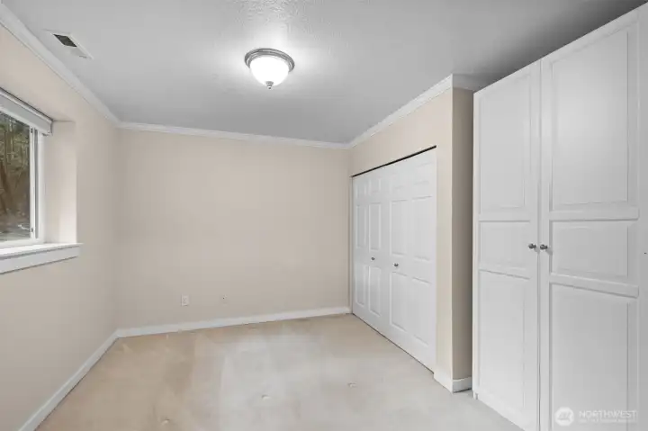 The downstairs 4th bedroom offers convenient, private space—ideal for guests, a home office, or multi-generational living.