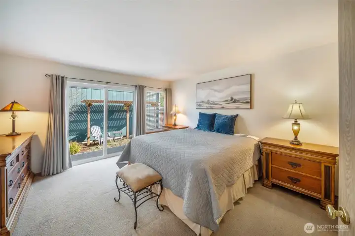 Primary suite is nicely located and features a slider out to a private yard area. The perfect spot to enjoy your morning coffee while you get ready for your day