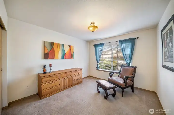 Bedroom #2 at the front of the house with views to the sidewalk and street. It would also make a great office