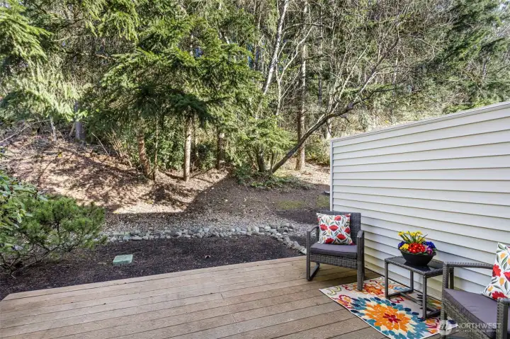 Deck Off Kitchen Backs To Lush Greenbelt