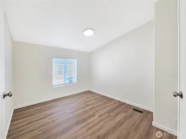 Flexible den space that works well as a home office, hobby room, media space, or optional fourth bedroom.