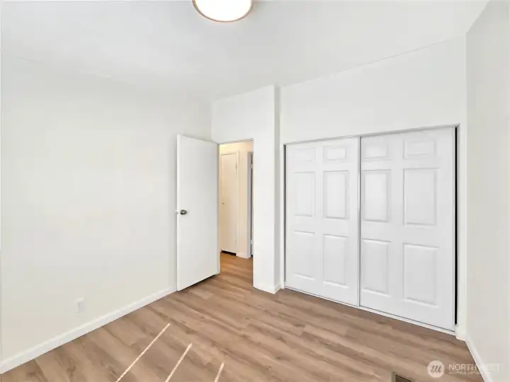 Third bedroom offering a functional layout and convenient access to the hall bath.