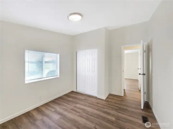 One of the two secondary bedroom with good natural light and closet space—ideal for guests, hobbies, or everyday living.