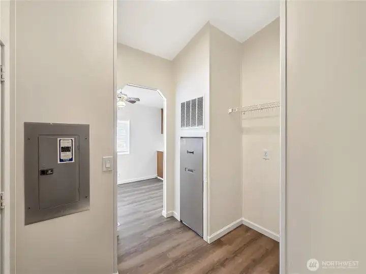 Functional laundry room with added storage and flexible space for a pantry cabinet, extra refrigerator, or freezer.