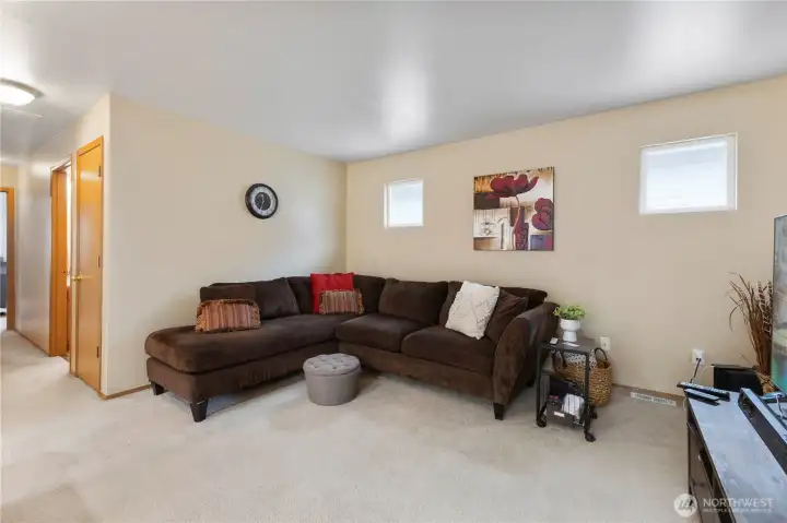 Privately situated picture windows & neutral paint create a warm & inviting space