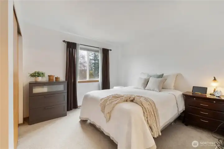 The primary suite is spacious and offers an ensuite full bath.