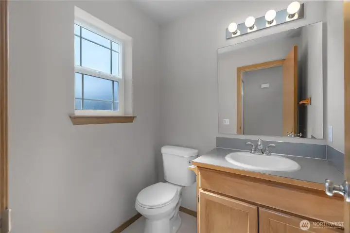 Half bath near entry, great for visiting guests.