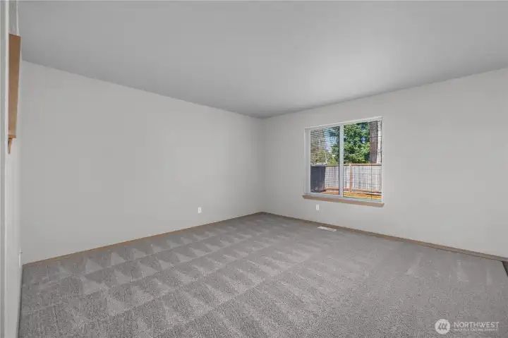 Spacious living room on main floor. New carpet throughout unit (7017).