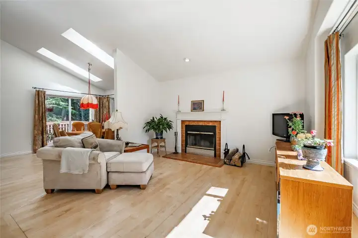 The open main living area features vaulted ceilings and skylights, bringing in great natural light and enhancing the sense of space.