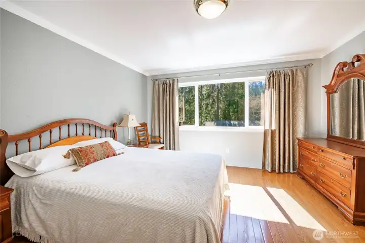 Upstairs primary bedroom with walk-in closet and full bathroom.