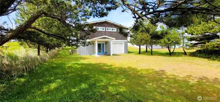A stunning oceanfront home featuring breathtaking views of the Pacific and rich Lindal cedar finishes throughout. Warm wood tones, expansive windows, and thoughtful architectural details create a seamless blend of coastal elegance and natural beauty—offering an inviting retreat with timeless charm.