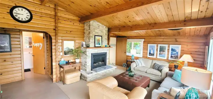 Striking craftsmanship shines in this beautifully designed space, where exposed beams, Lindal cedar walls, and expansive windows harmonize to create a seamless blend of rustic elegance and coastal living.