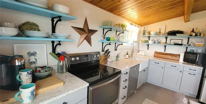 Elegant quartz countertops and a farmhouse sink - where functionality meets coastal charm.