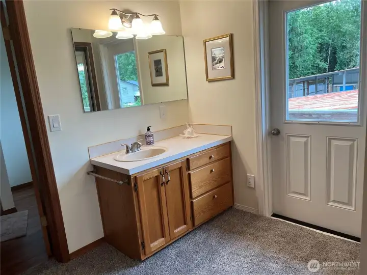 Powder room with deck access from second floor.