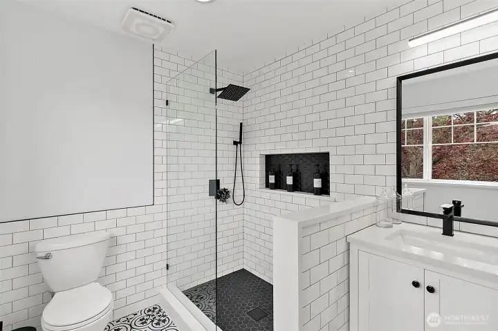 upstairs guest bathroom with custom tile walk in shower
