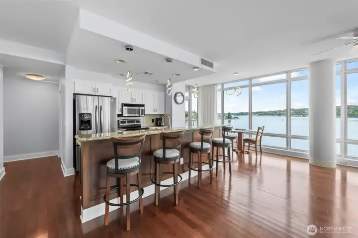Delight in the kitchen with granite countertops, stainless steel appliances and kitchen island with breakfast bar.