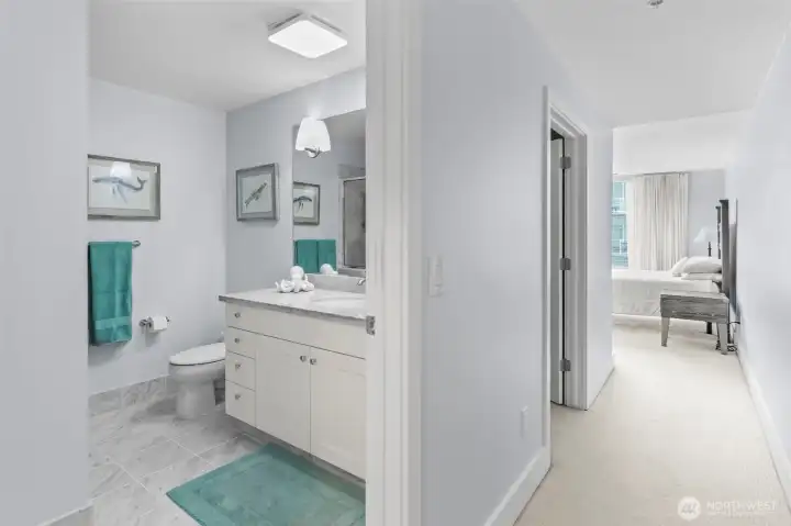 Retreat to the primary suite with 3/4 bath and walk-in closet