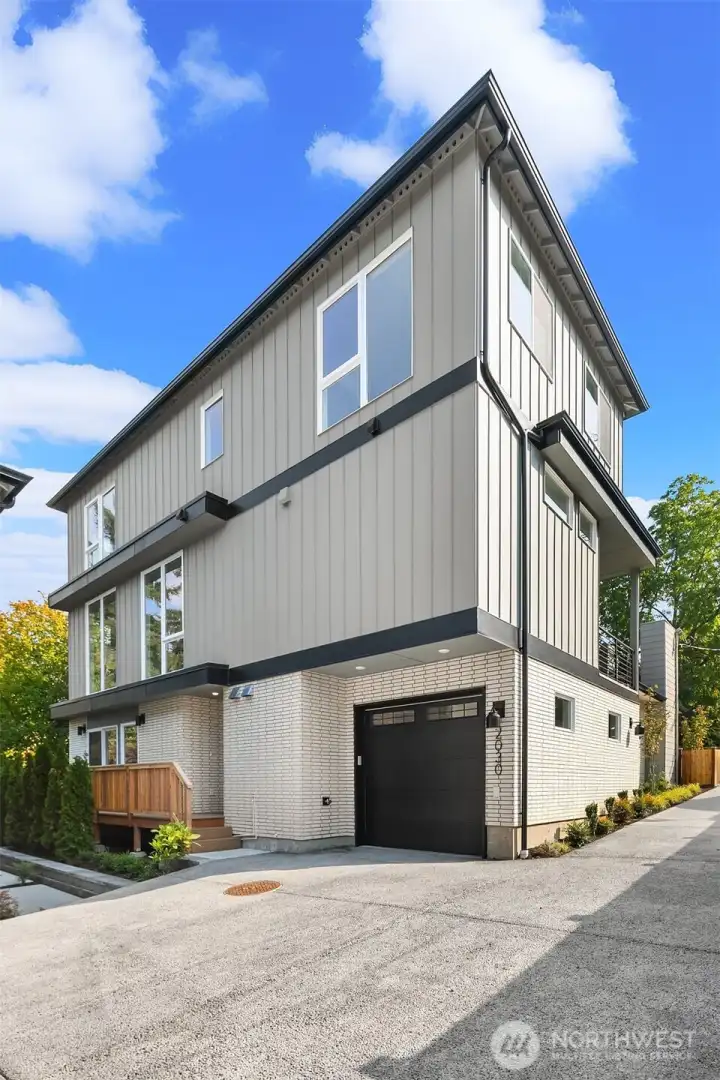 Attached garage plus dedicated guest parking.