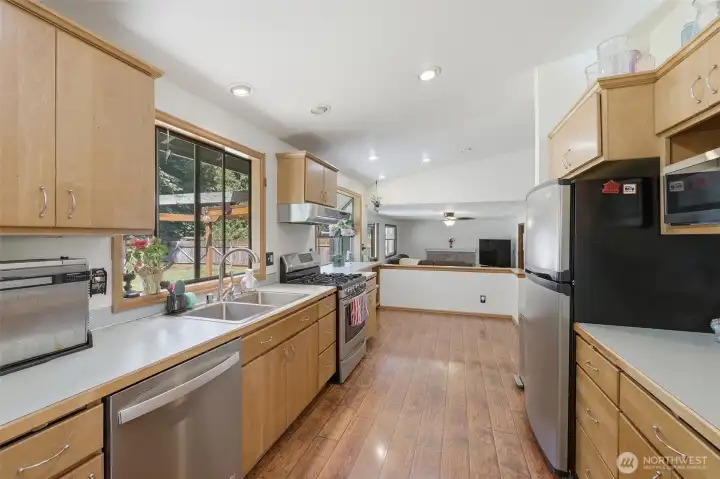 Kitchen with stainless steel appliances, gas range and eating nook. Kitchen with stainless steel appliances, gas range and eating nook.