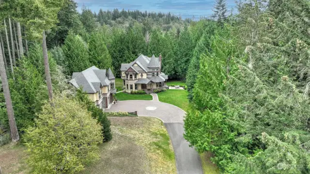 Nestled on 20 breathtaking acres of pristine lakefront, this estate is a true masterpiece of craftsmanship and design.