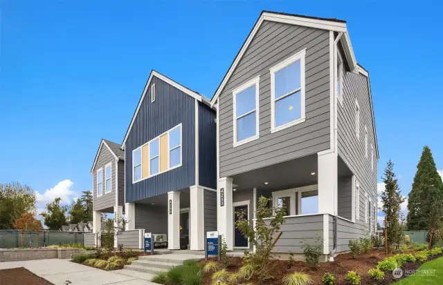 Model home Unit A shown on right side, gathering room and primary suite windows facing front.