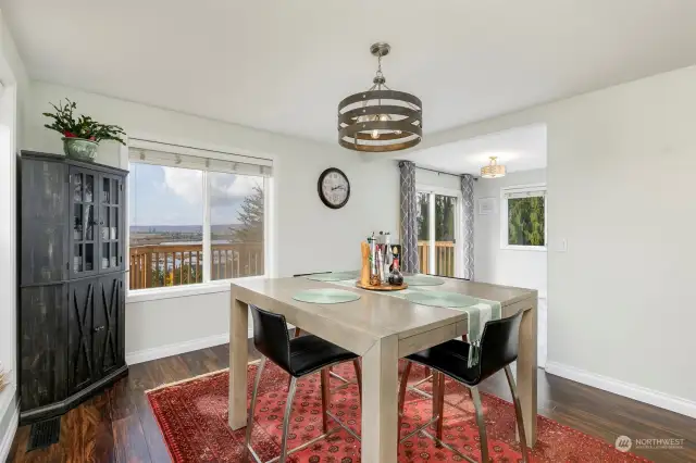 Dining room enjoys western views; note eating nook off to right as well