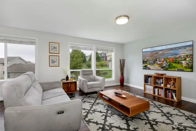 Spacious living room bathed in natural light