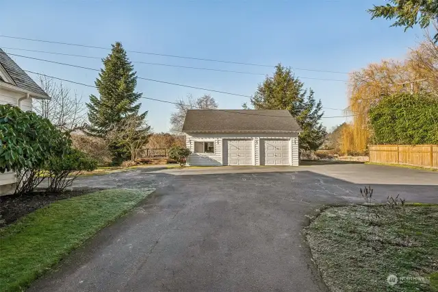 Detached 2 car + shop space and views over Clark's Creek + ample parking options!