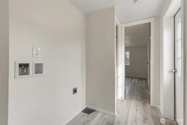 Laundry in the hall with bath down & to the left & primary at the end of the hall