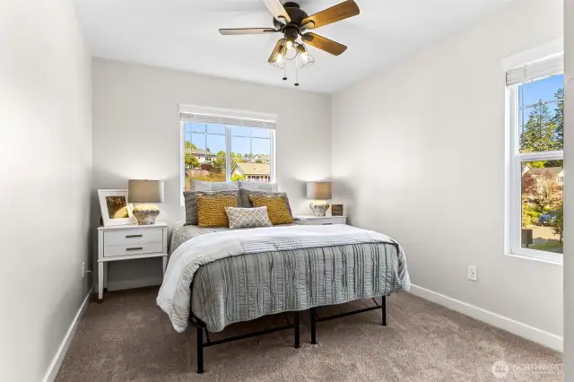 Second bedroom with ceiling fan.