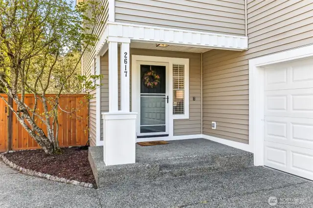 Welcoming front porch with a screen door.