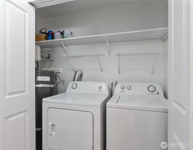 Laundry area with new hot-water tank