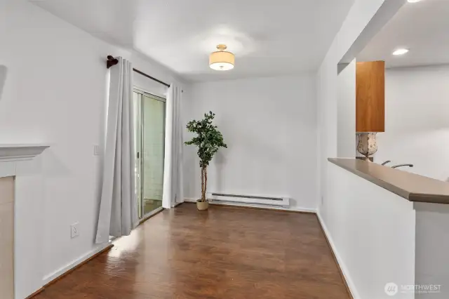 Dining area leads to covered patio area and backyard