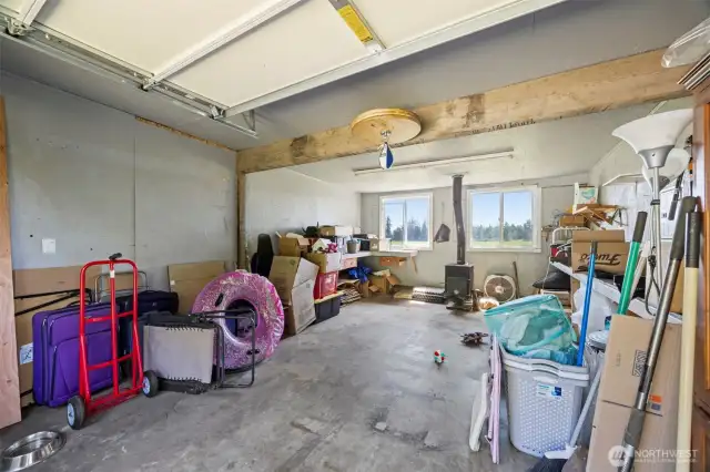 Additional Parking or shop area in this two bay detached garage. All set up with power and Stove.
