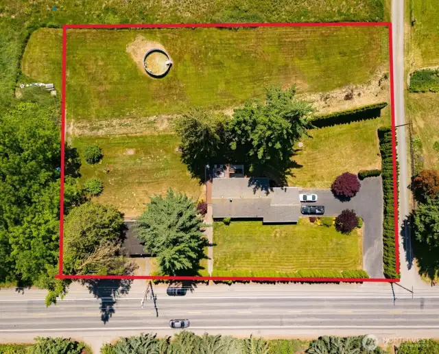 Boundary stakes are set at SE and SW corners.  Owner mows the portion in the corner and parks a vehicle if needed.